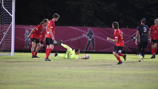 Sunshine Coast keeps one out of the net in Magpies Crusaders v Sunshine Coast Fire in the FQPL1 at Sologinkin Oval. Saturday, March 19, 2022. Picture: Tara Miko
