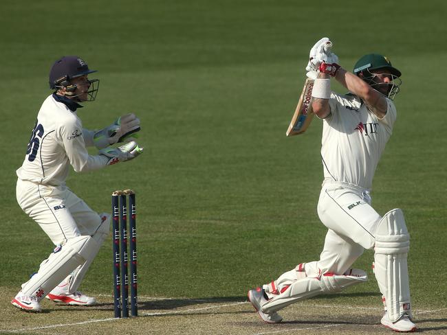 Matthew Wade of Tasmania (right) batting with Seb Gotch of Victoria watching on day 3 during the Round 4 Sheffield Shield between Tasmania and Victoria at Blundstone Arena in Hobart, Monday, November 19, 2018. (AAP Image/Hamish Blair) EDITORIAL USE ONLY, IMAGES TO BE USED FOR NEWS REPORTING PURPOSES ONLY, NO COMMERCIAL USE WHATSOEVER, NO USE IN BOOKS WITHOUT PRIOR WRITTEN CONSENT FROM AAP