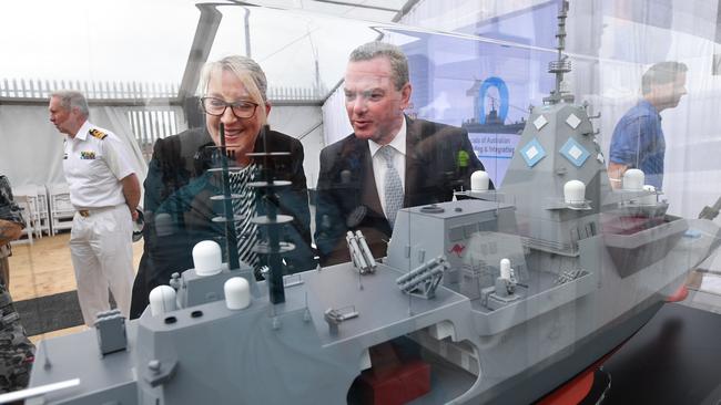 Former defence minister Christopher Pyne with a model of the British Type 26 frigate. Picture: AAP