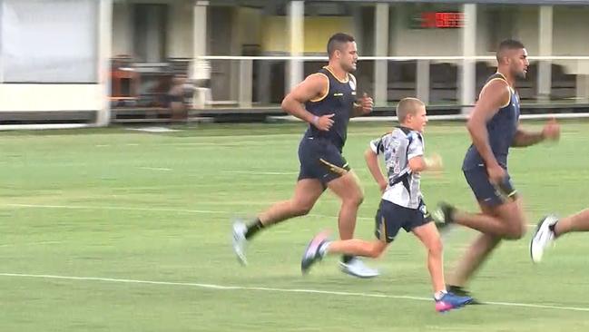 The son of Brad Arthur is pictured accelerating past Jarryd Hayne.