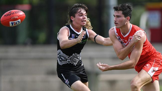 Ryan Warfe (left) played for Palmerston earlier this year. Picture: Felicity Elliott / AFLNT Media