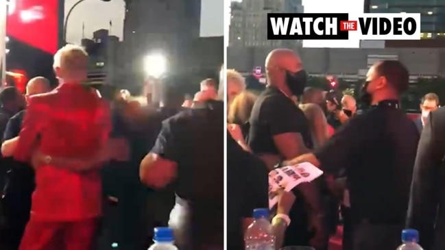 Conor McGregor throws punch at Machine Gun Kelly at MTV Awards