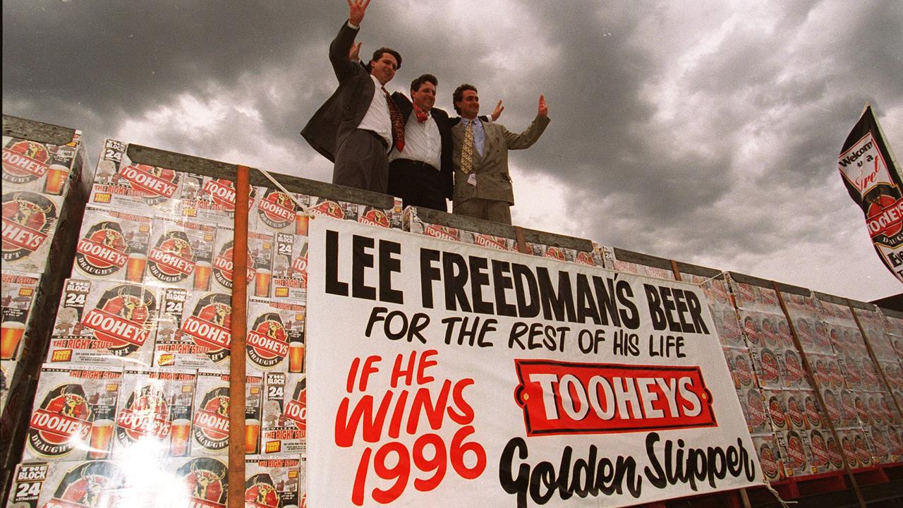 (L-R) Racehorse trainers and brothers Richard, Lee and Michael Freedman, with beer won for winning the Tooheys Golden Slipper.
  Turf Free/Fam