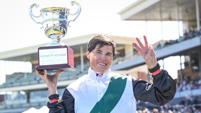 Craig Williams raises the Futurity Stakes trophy. Picture: Reg Ryan/Racing Photos via Getty Images