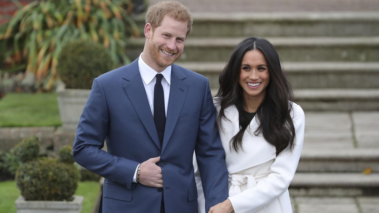 Harry and Meghan posed for photographs in the Sunken Garden at Kensington Palace in 2017 following the announcement of their engagement. Picture: AFP/Daniel Leal-Olivas