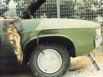 The burnt out Ford Falcon that Brown was found inside of pictured here at the police station during the investigation.