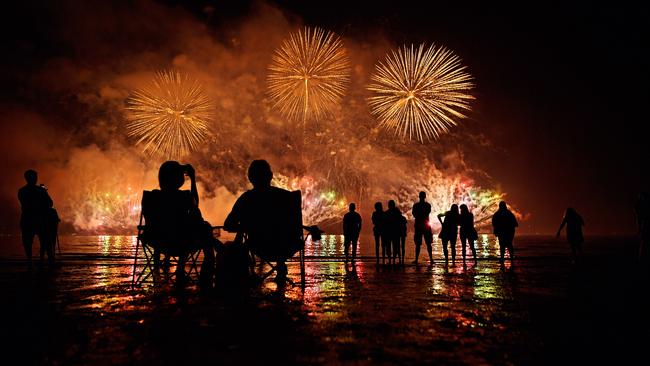 Territorians watch on as the main fireworks display goes off with a bang at the Mindil Beach Territory Day 2017 celebrations.