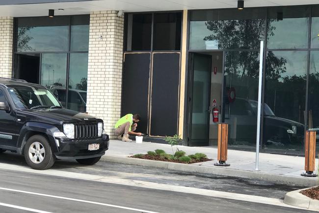 Workers putting the finishing touches on the Westfield Coomera at Coomera Town Centre