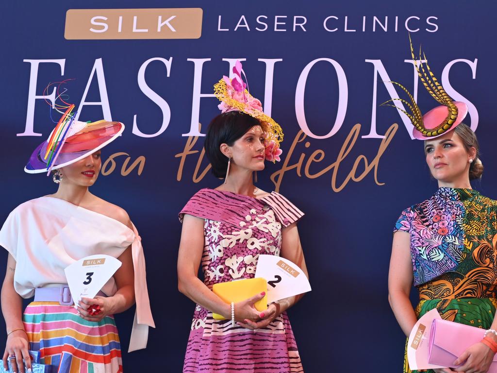 Jaimee Bruggemann, Allison Harvy and Hannah Burns in the 2021 Darwin Cup Carnival Fashions on the Field competition. Picture: Julianne Osborne