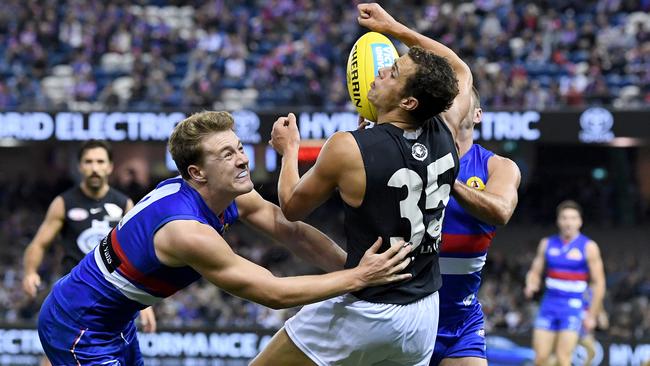 Jack Macrae and Caleb Daniel tackle Ed Curnow.