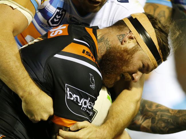 Chris McQueen of the Tigers is tackled during the Round 7 NRL match between the Wests Tigers and the Gold Coast Titans at Scully Park in Tamworth, Saturday, April 27, 2019. (AAP Image/Darren Pateman) NO ARCHIVING, EDITORIAL USE ONLY