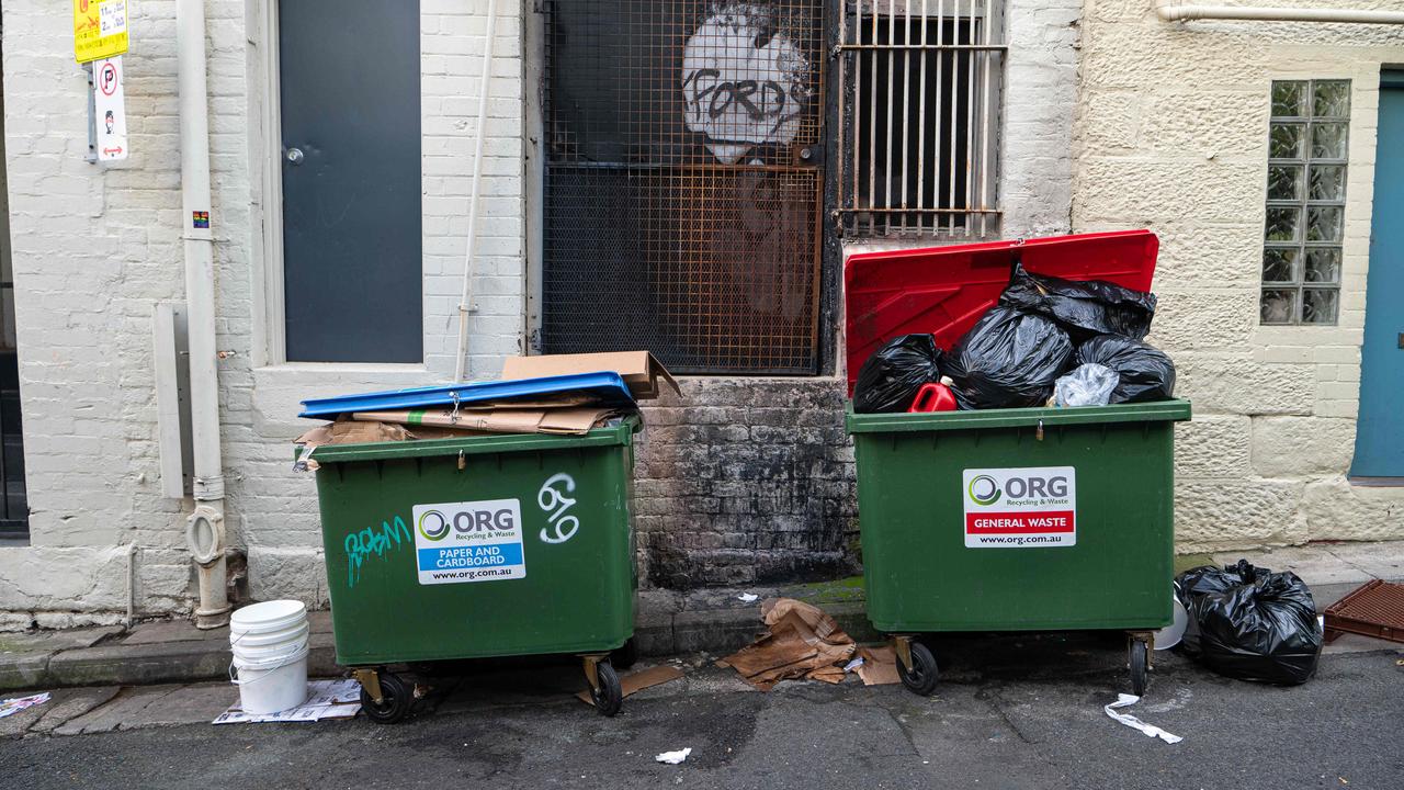 Bins were left overflowing after Saturday night’s celebrations. Picture: NCA NewsWire / Flavio Brancaleone