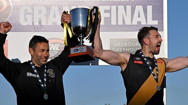 Heidelberg coach Vinny Dattoli and captain Sam Gilmore celebrate after winning the NFNL Division 1 grand final. Picture: Andy Brownbill