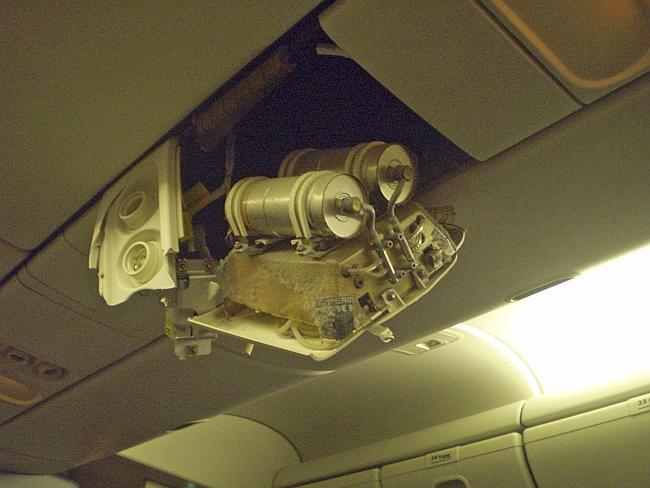 Part of the interior of a Continental Airlines plane is shown damaged after the jet hit turbulence in 2009. More than two dozen people were hurt. Picture: AP