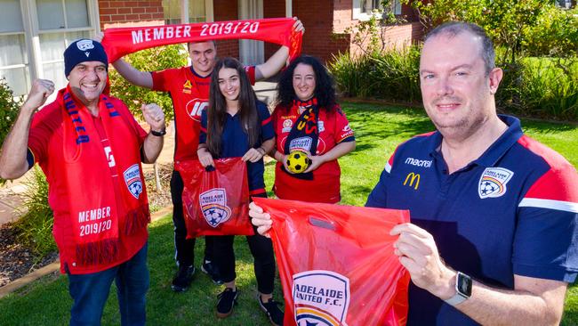 Mr van der Pol delivering Reds merchandise to the Tsokkos family in 2020. Picture: Brenton Edwards