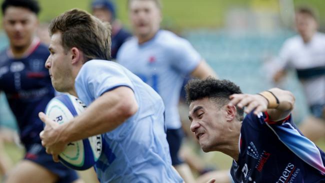 Waratahs' Liam Grover with the ball chased by Melbourne Rebels' Journey Ioane. Under 19s Waratahs  v Melbourne Rebels in Super Rugby National Championships Round 1 at Leichhardt Oval. Picture: John Appleyard.