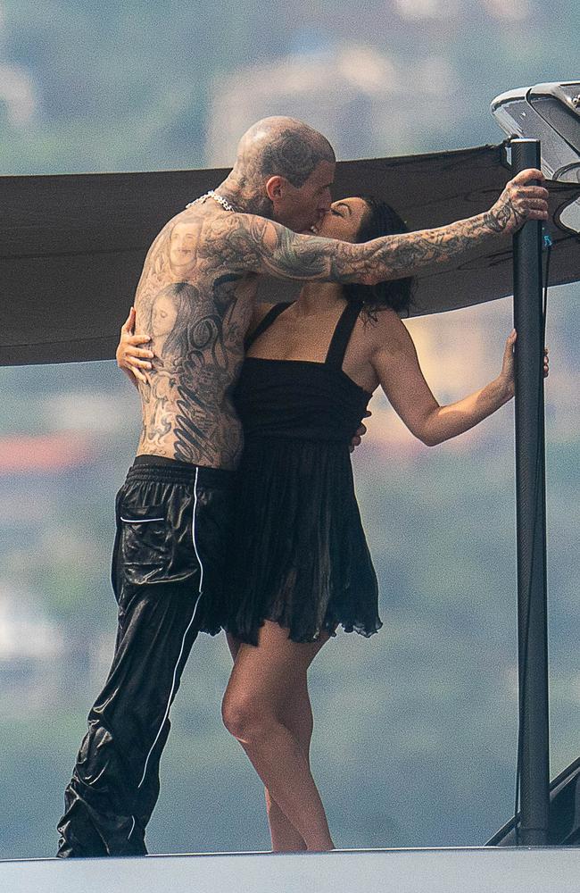 The couple shared a kiss back on the boat, with their sleepwear still wet from the water. Picture: Robino Salvatore/GC Images