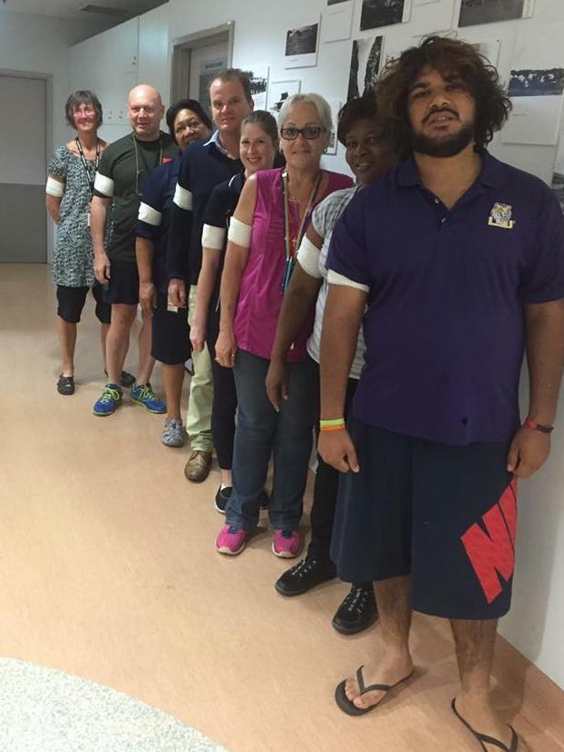 Health workers and nurses wearing bandages for Gayle Woodford at Alice Springs.