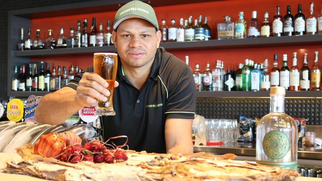 Something Wild owner Daniel Motlop and his wattleseed lager. Picture: Supplied