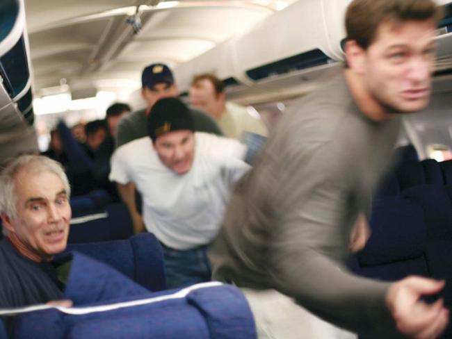 Haunting re-creation ... Hostages taking action against the hijackers in a scene from the film "United 93".