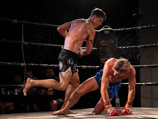 Athlete Muay Thai's Quinton Smith knocks Rippers Muay Thai's Oliver Hanson down during their 4-Man King of the North fight. Picture: Supplied