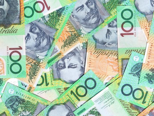 Australian one hundred dollar notes make a full-frame background.