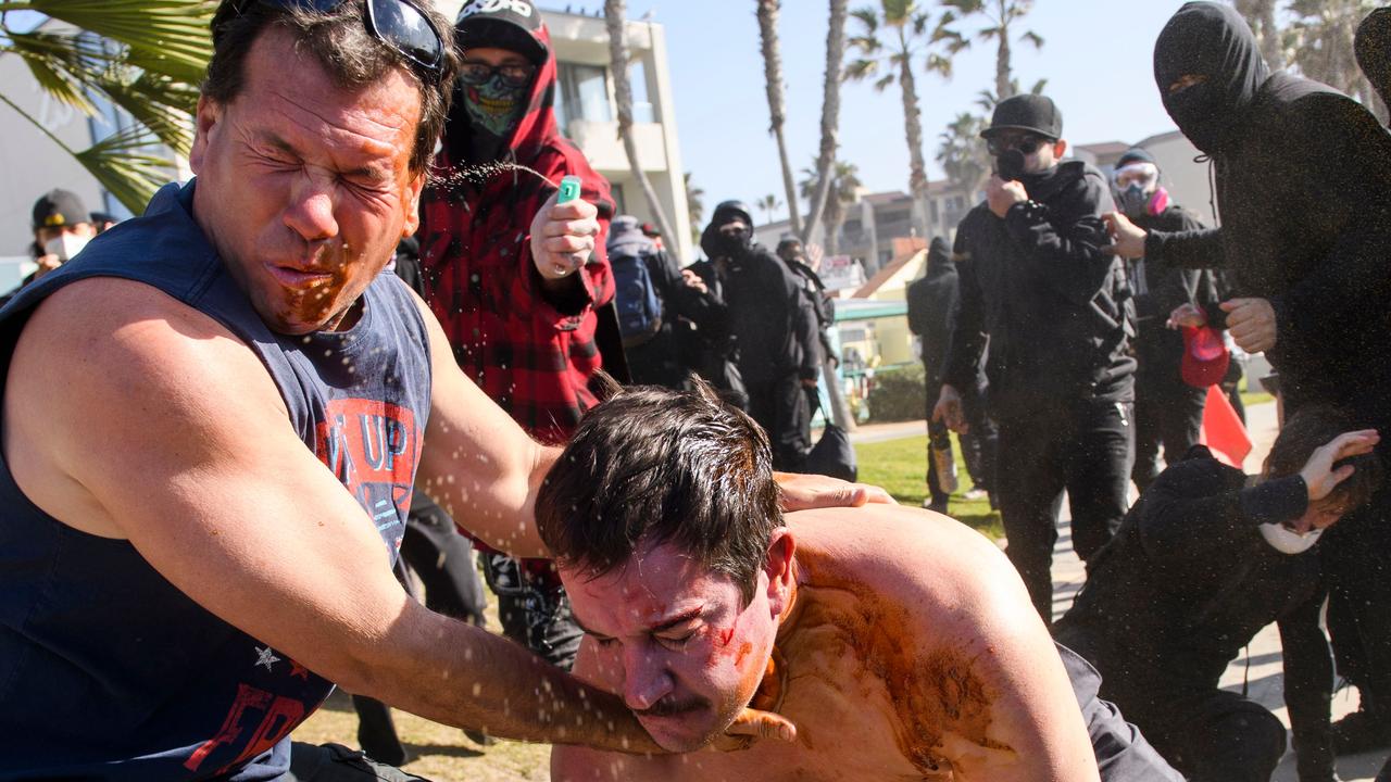 Counter-protesters used pepper spray as they clashed with Trump supporters during the ‘Patriot March’ demonstration. Picture: Patrick T. Fallon/AFP