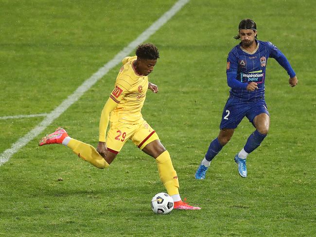 NEWCASTLE, AUSTRALIA - MARCH 21: Kusini Yengi of Adelaide United scores a goal during the A-League match between the Newcastle Jets and Adelaide United at McDonald Jones Stadium, on March 21, 2021, in Newcastle, Australia. (Photo by Mark Metcalfe/Getty Images)