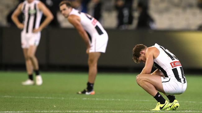 Taylor Adams and Steele Sidebottom after the defeat. Picture: Wayne Ludbey