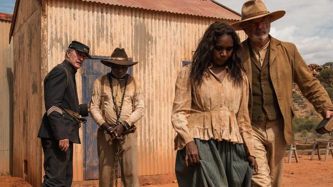 L-R: Sergeant Fletcher (Bryan Brown), Sam (Hamilton Morris), Lizzie (Natassia Gorey-Furber) and Fred Smith (Sam Neill) head to court in a scene from Australian film Sweet Country