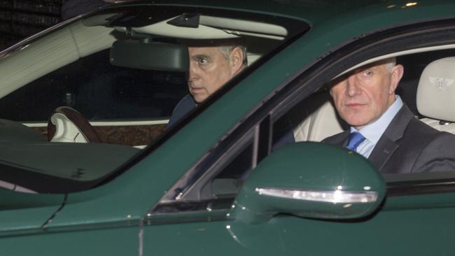 The Duke of York leaves Buckingham Palace with a member of his security detail. Picture: Doug Seeburg.