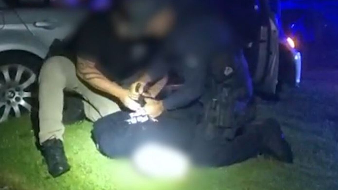 The arrest of a 23-year-old man at Redcliffe after he crashed an allegedly stolen BMW. Picture: QPS