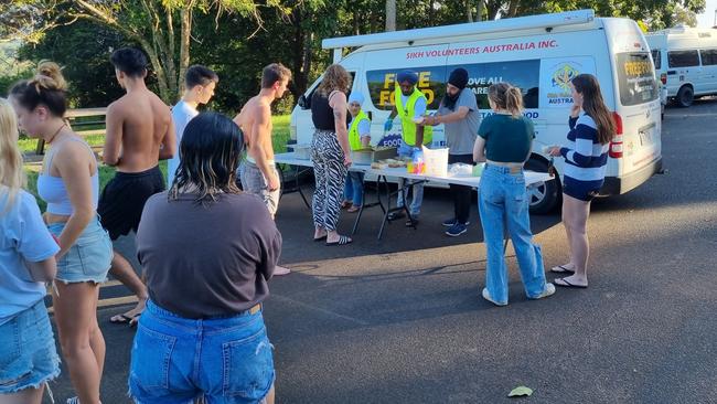 Sikh community members provide aid to people in Lismore. Picture: Jaswinder Singh