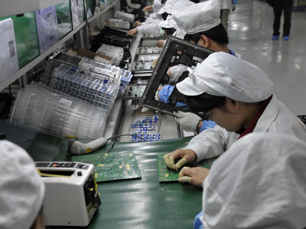 Workers on the floor will soon be a thing of the past. (Photo by AFP) / China OUT