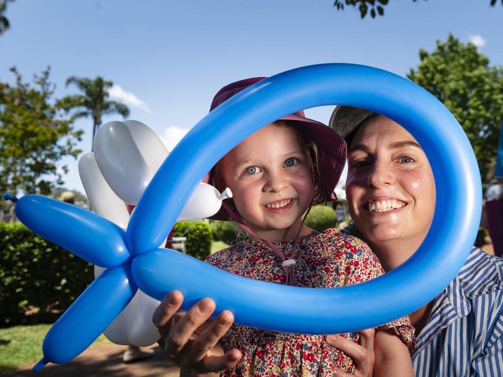 Rachel Wise and daughter Margot Wise play with balloon sculptures at Fairholme Spring Fair, Saturday, October 19, 2024. Picture: Kevin Farmer