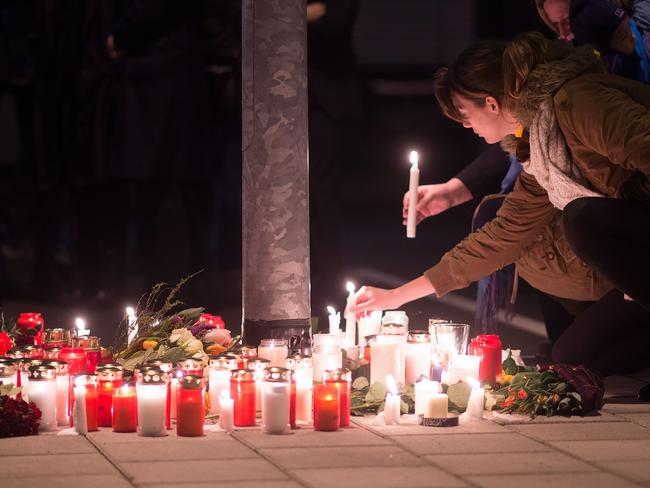 Staff members of Germanwings and Lufthansa hold a candlelight vigil at Dusseldorf Airport. Pic: Marius Becker