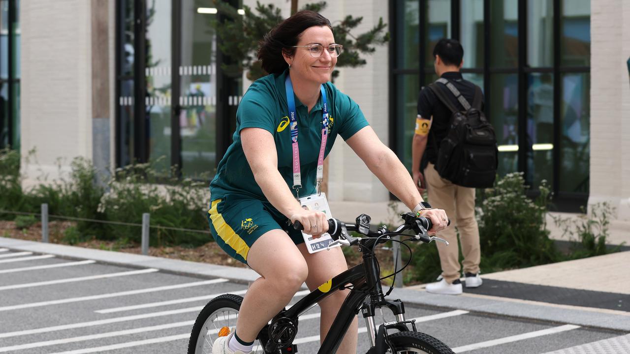 Chef de mission Anna Meares rides around as the Australian swim team arrive at the Olympic Village. Picture: Adam Head