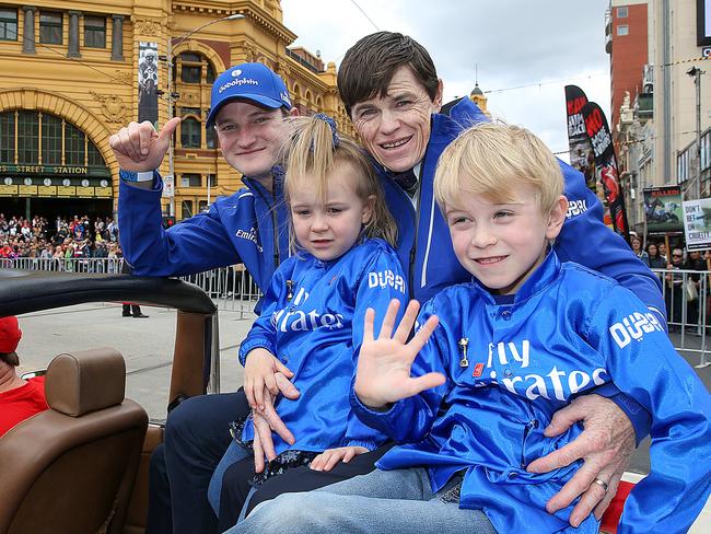 Craig Williams with his children and James Ferguson at the Melbourne Cup parade. Picture: Ian Currie