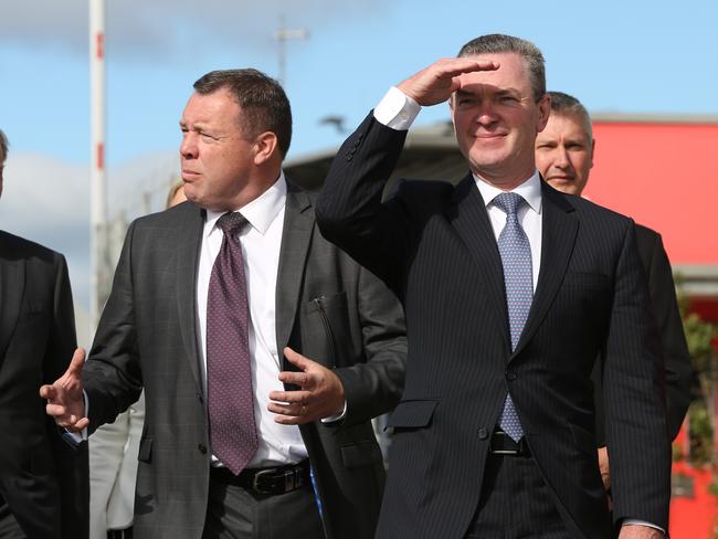 Minister for Defence Industry Christopher Pyne with Graeme Hunter GM of KBR on his right about to announces a Naval Shipbuilding College during a visit a visit to AWD construction yard, Osborne, Adelaide,Tuesday, April 3, 2018. (AAP Image/Russell Millard) NO ARCHIVING