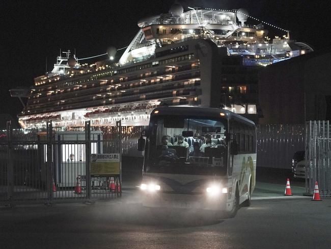 Buses carrying Australian passengers from the quarantined Diamond Princess cruise ship leave a port in Yokohama, near Tokyo. Picture: AP