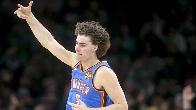OKLAHOMA CITY, OKLAHOMA - JANUARY 03: Josh Giddey #3 of the Oklahoma City Thunder celebrates after making a three point basket during the third quarter against the Boston Celtics at Paycom Center on January 03, 2023 in Oklahoma City, Oklahoma. NOTE TO USER: User expressly acknowledges and agrees that, by downloading and or using this photograph, User is consenting to the terms and conditions of the Getty Images License Agreement.  (Photo by Ian Maule/Getty Images)