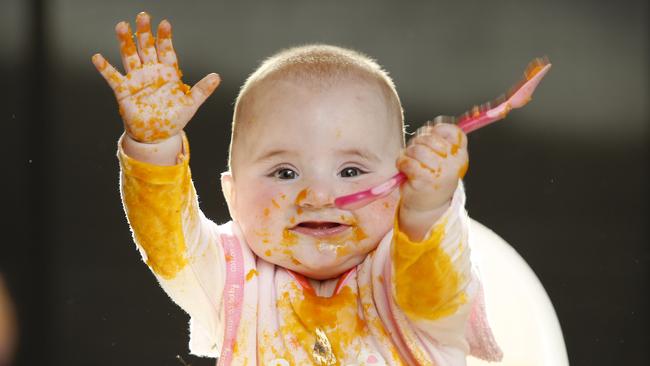 Ada Emmerson, seven months old, enjoys her mashed pumpkin. Picture: David Caird.