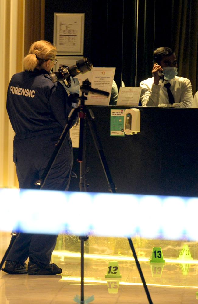 Police at the apartment building on Spencer St. Picture: Andrew Henshaw