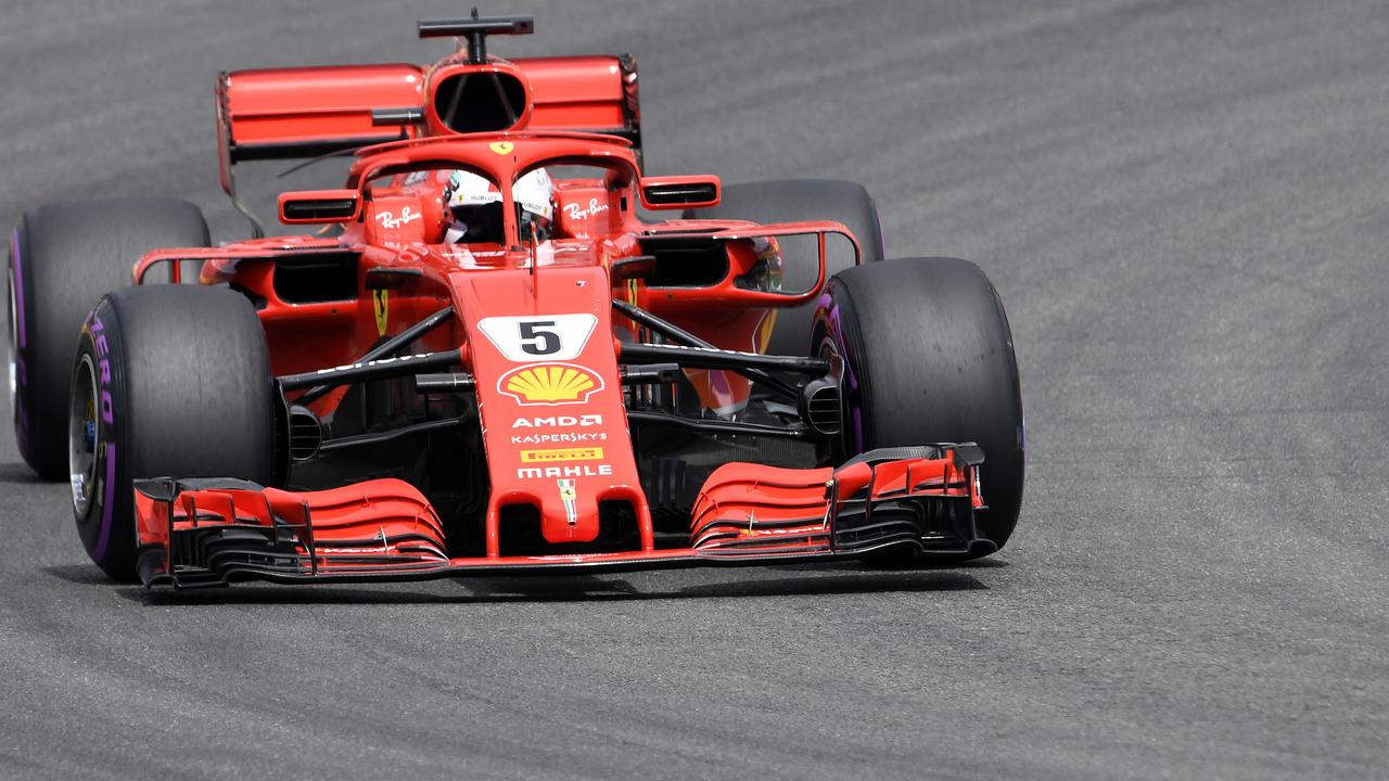 Ferrari driver Sebastian Vettel of Germany steers his car during qualifying.