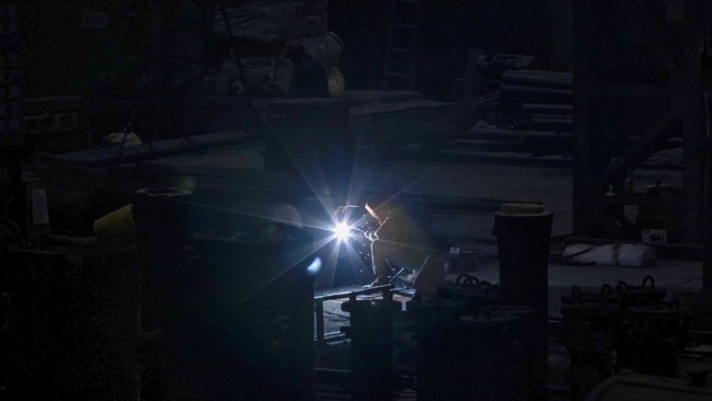 A man welds in a Tiangong International factory in Zhenjiang. Picture: Alex Plavevski/Shutterstock/WSJ