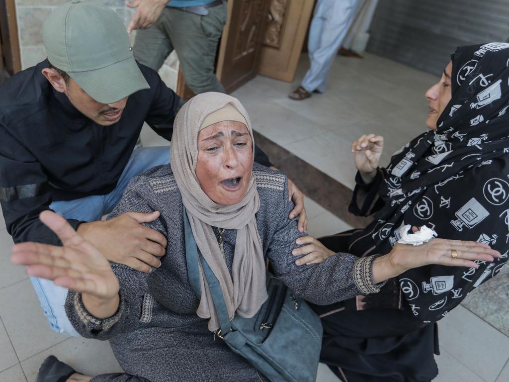 People mourn as they collect the bodies of Palestinians killed in Israeli raids in Khan Yunis, Gaza. Picture: Getty Images