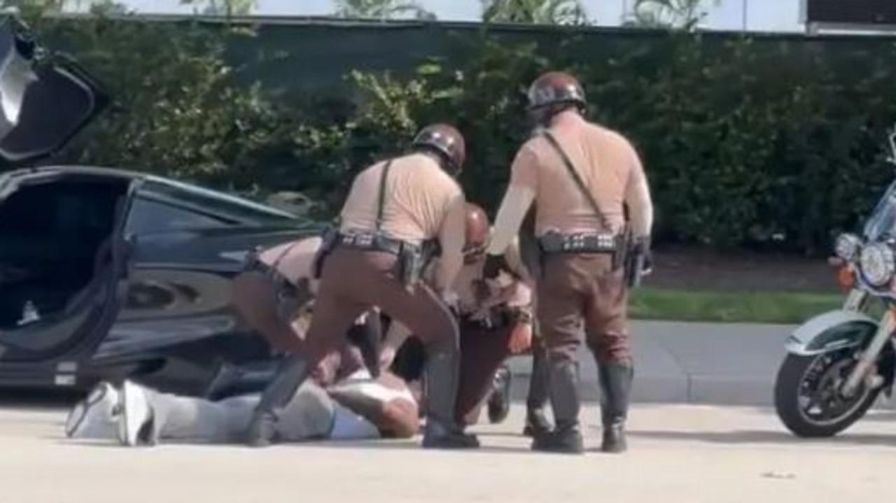 Footage that appears to show Tyreek Hill being arrested.