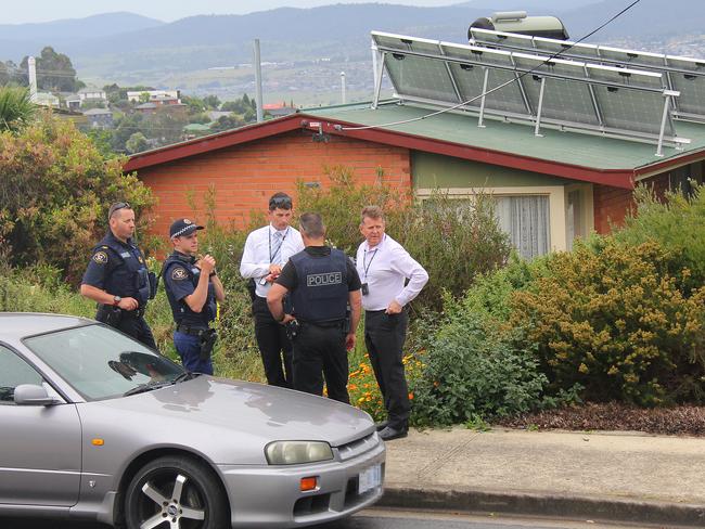 Tasmania Police outside the house.   Picture: BRUCE MOUNSTER