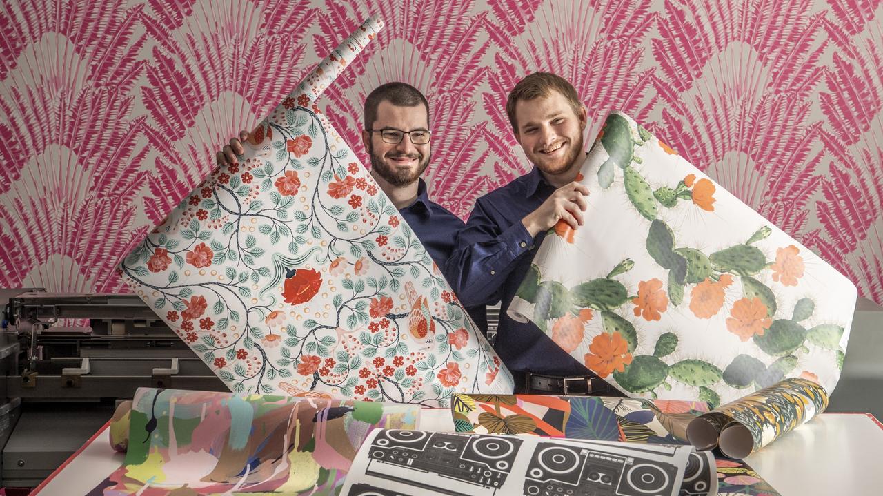 BRIGHTEN UP: Milton and King Wallpaper and Fabric Co Toowoomba print operators Brodie Henry (left) and Benjamin Oberhardt. Picture: Nev Madsen