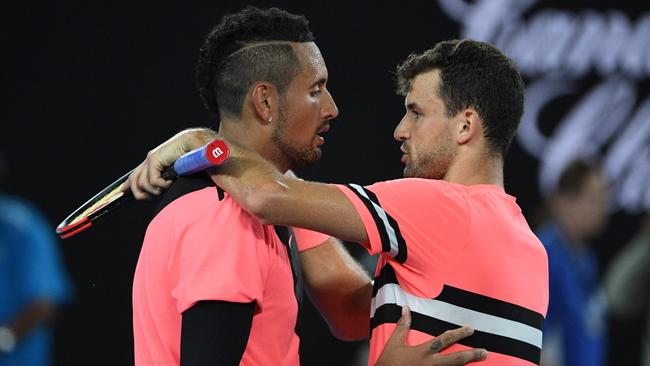 Bulgaria's Grigor Dimitrov (right) speaks with Australia's Nick Kyrgios after winning their men's singles fourth round match. Photo: AFP